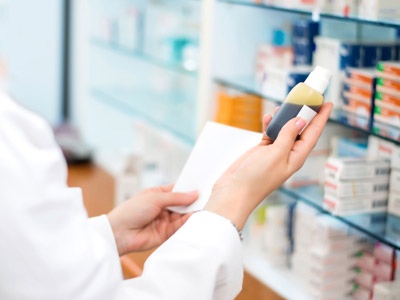 Pharmacist holding medication