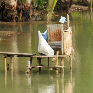 A tropical toilet above the river.