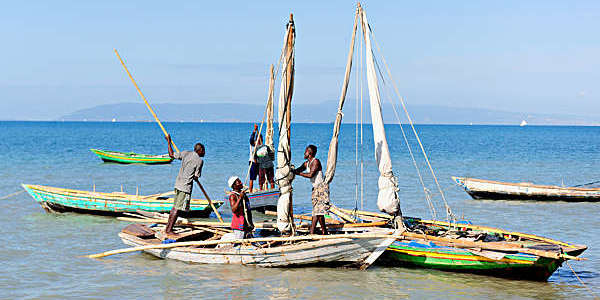Haitian fishermen preparing their boats for a day's work. 