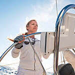 Female skipper sailing on sailbot, copy space
